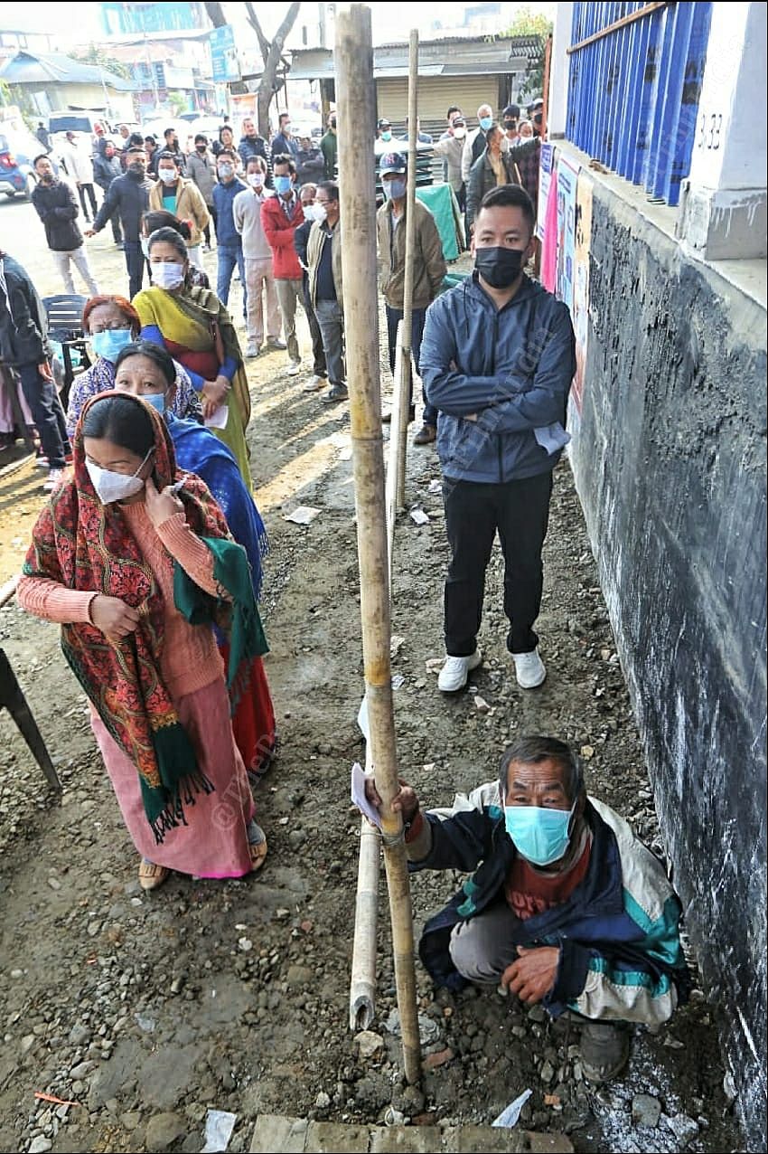 Voters in a queue waiting outside polling booth to cast their vote at Lamlai, Manipur | Praveen Jain | ThePrint