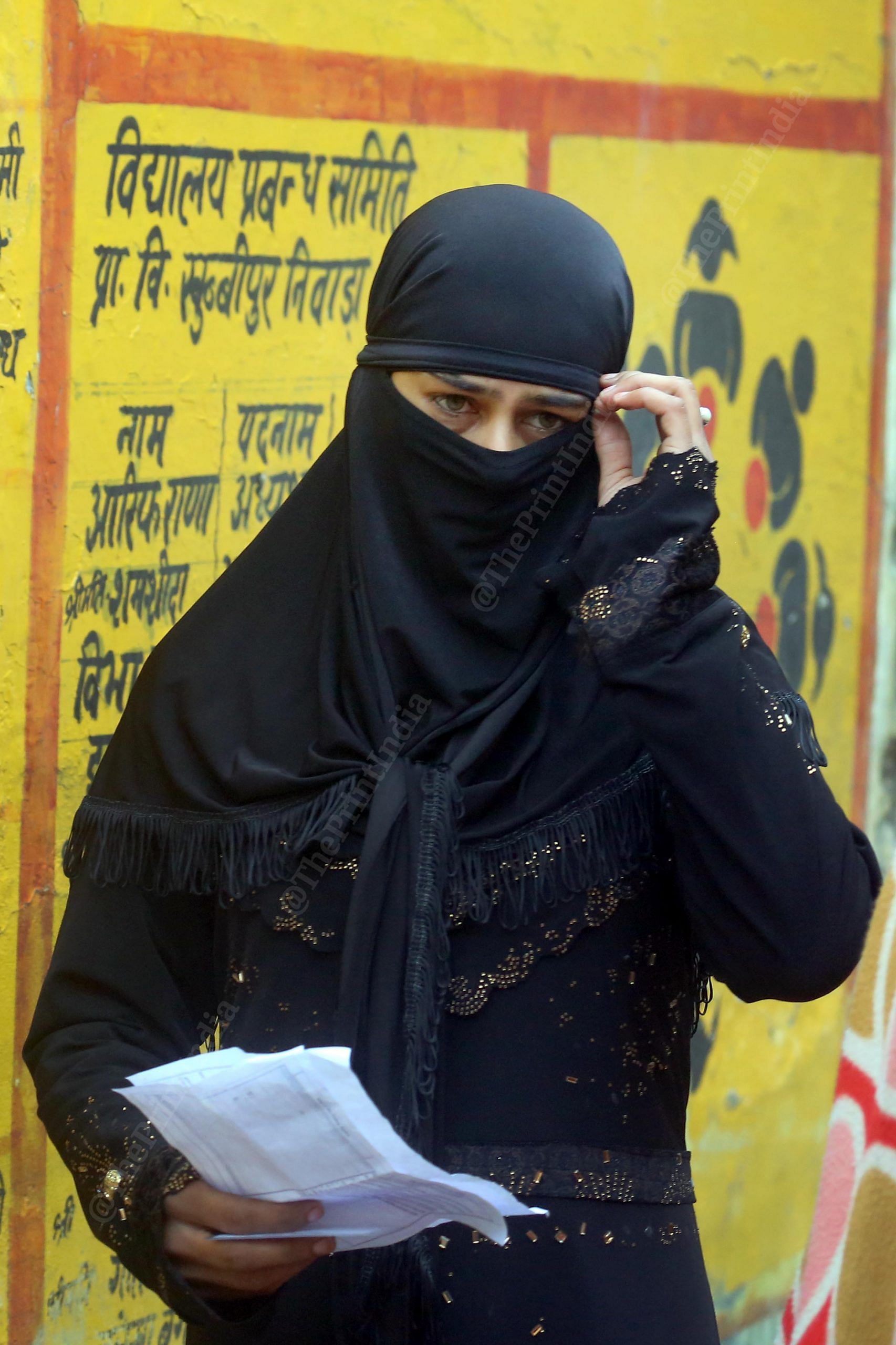 A woman on her way to cast her vote in the first phase of UP Assembly polls Thursday | Praveen Jain | ThePrint