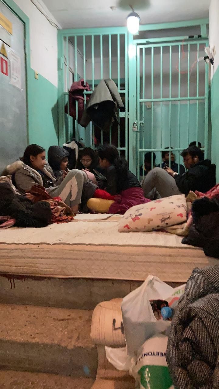 Indian students check their phones in the basement of a hostel in Kharkiv, waiting for news about evacuation efforts, Sunday | Divya Singh | By special arrangement