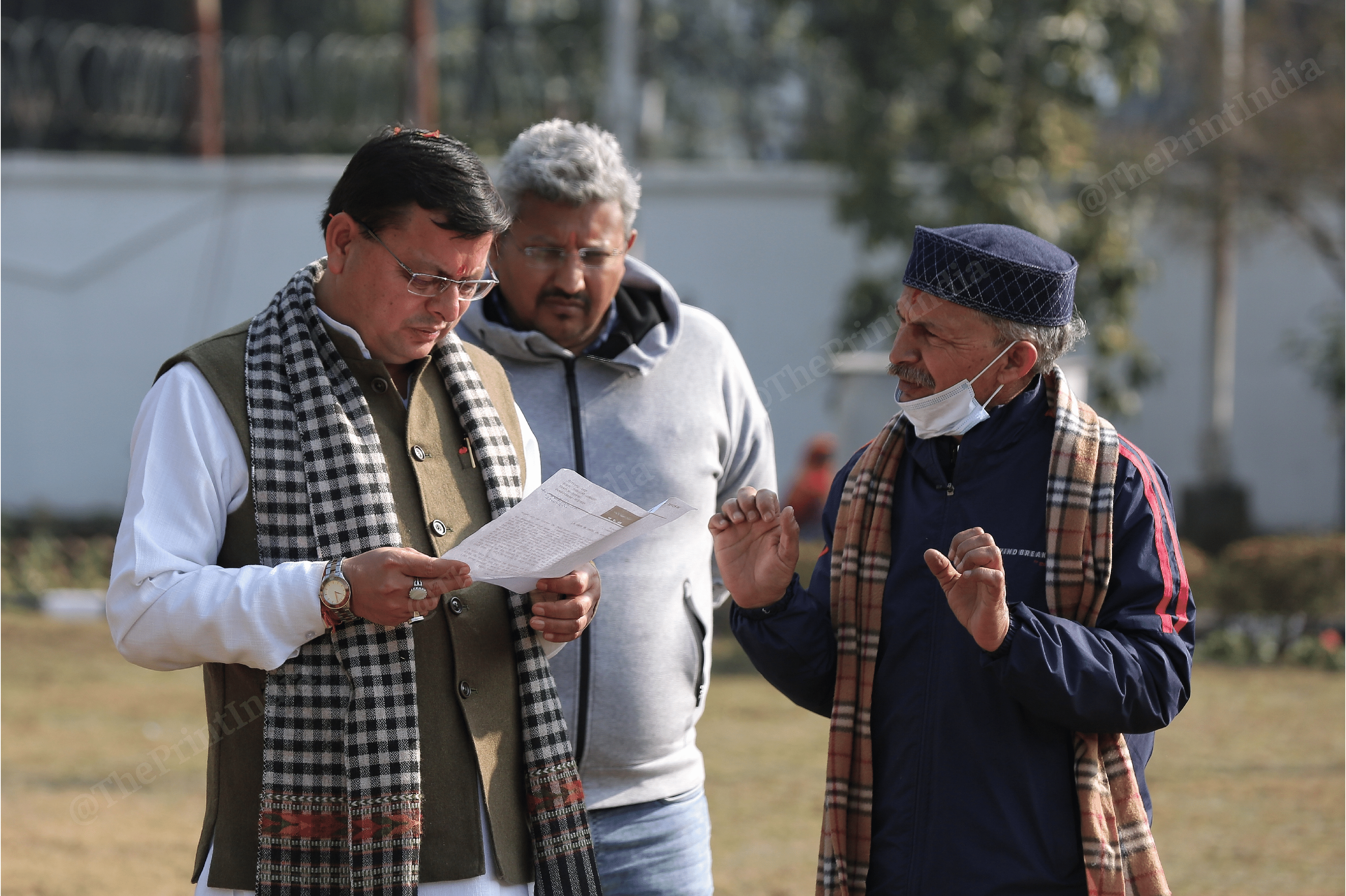Uttarakhand CM Pushkar Singh Dhami was seen interacting with party leaders and other members at his residence in Dehradun | Photo: Suraj Singh Bisht | ThePrint