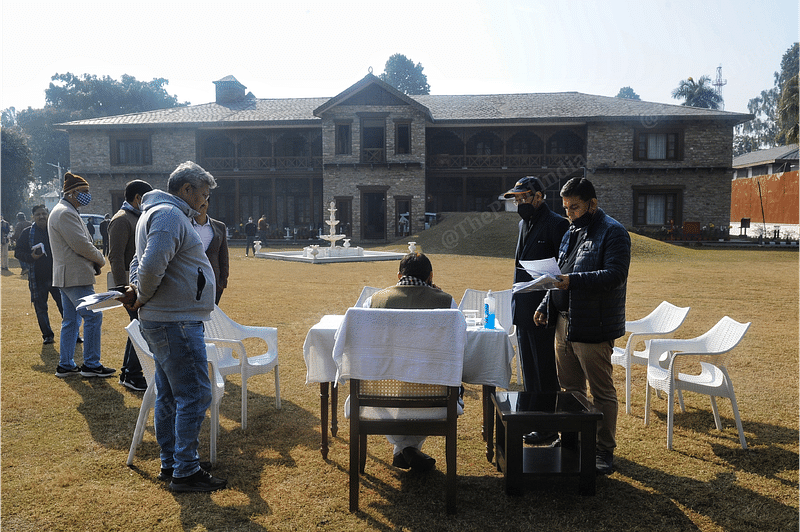 Uttarakhand CM Pushkar Singh Dhami in discussion with his team members at his residence in Dehradun | Photo: Suraj Singh Bisht | ThePrint