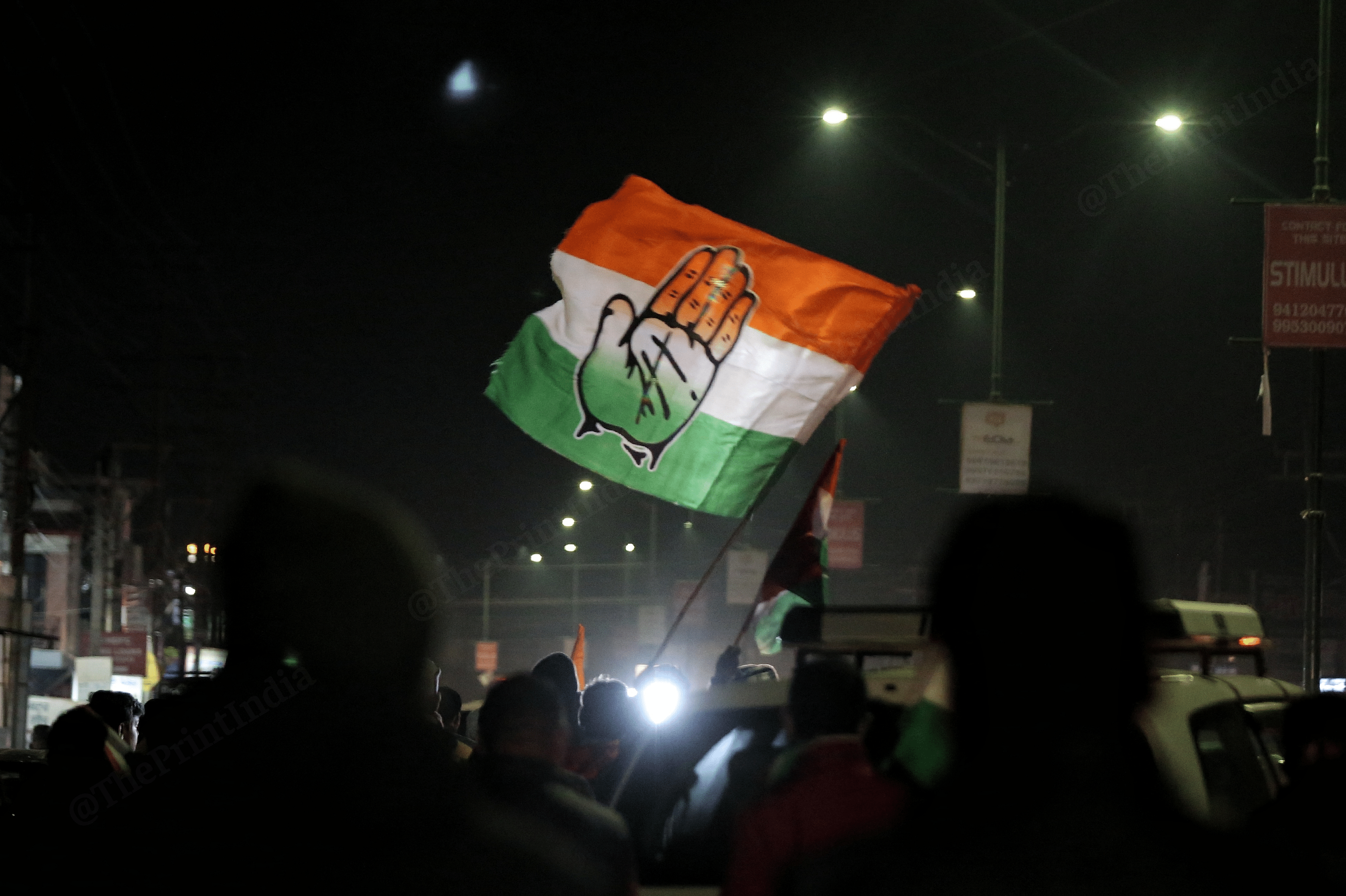 Congress Supporters cheering up with flags during door to door campaign at Doiwala | Photo: Suraj Singh Bisht | ThePrint