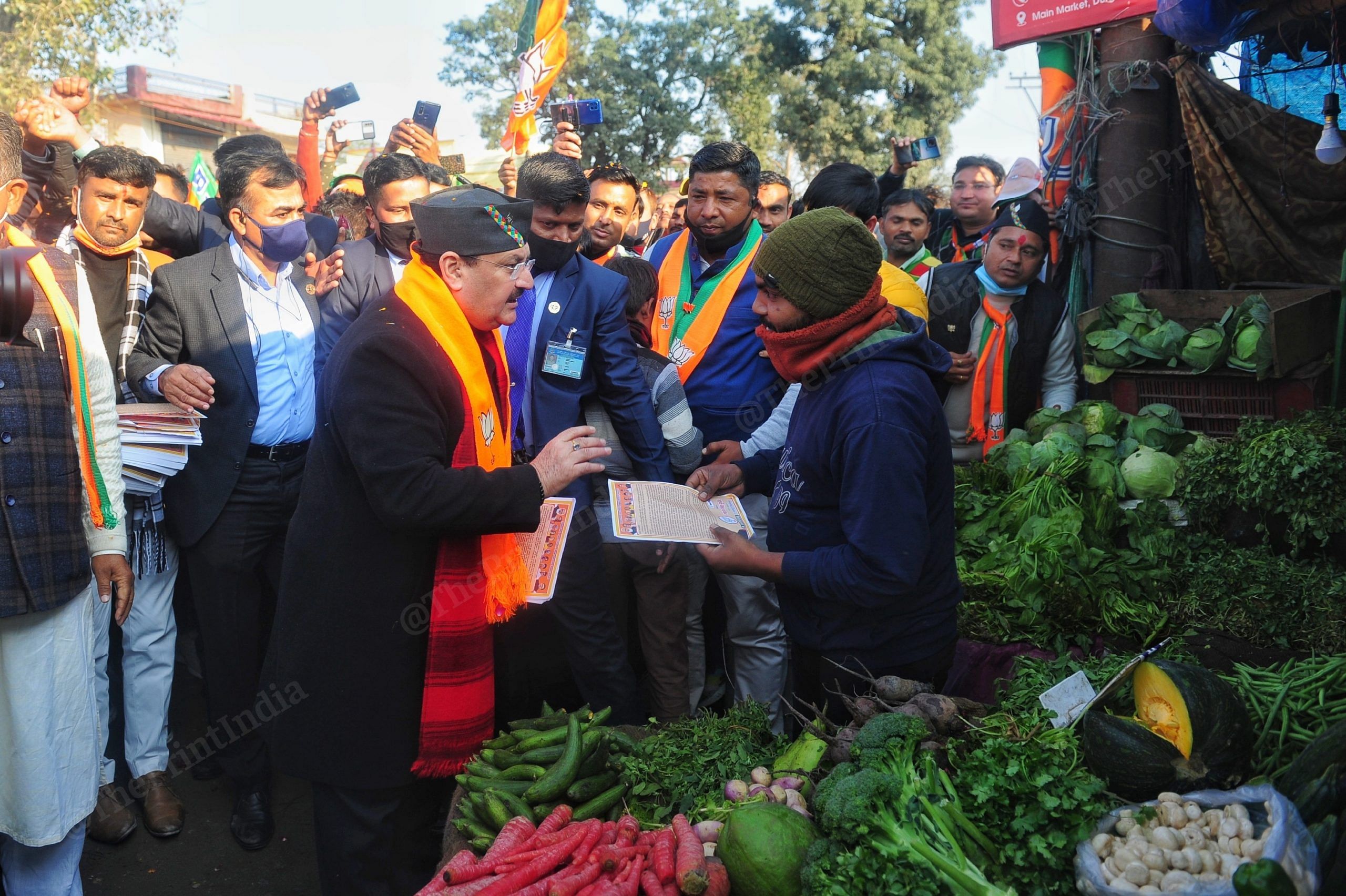 BJP president J.P Nadda interacting with residents was seen sharing pamphlets in Support of his party | Photo: Suraj Singh Bisht | ThePrint