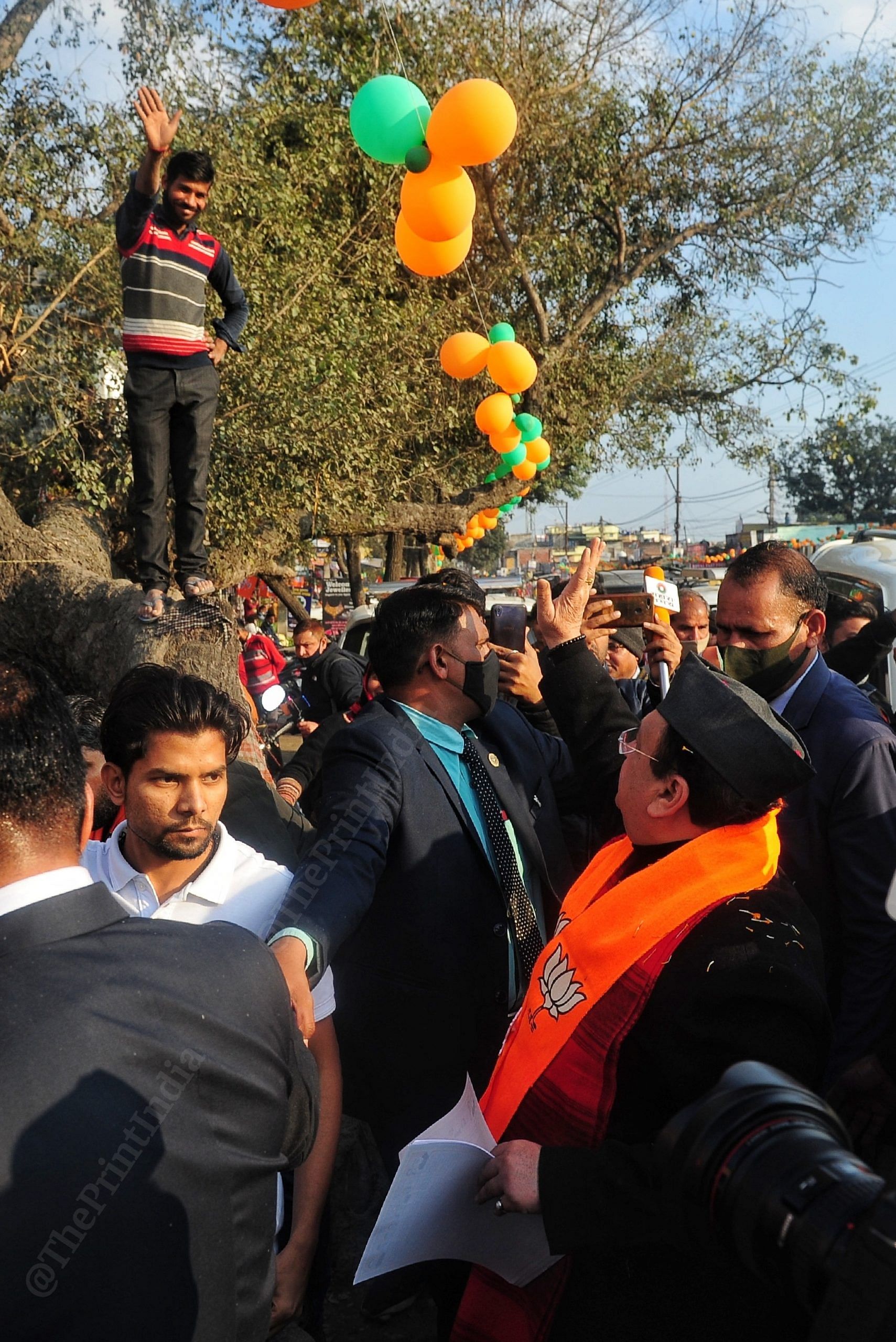 BJP president J.P Nadda during his visit for door to door campaign cheering the local residents ahead of Uttarakhand elections | Photo: Suraj Singh Bisht | ThePrint