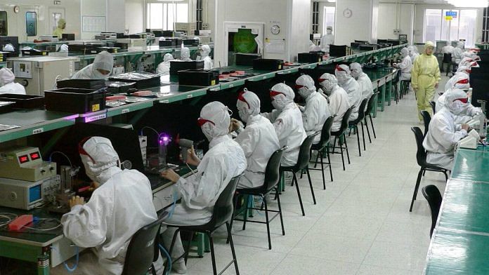 Workers on a production floor at a Foxconn factory in Shenzhen, China | Representational image | Commons