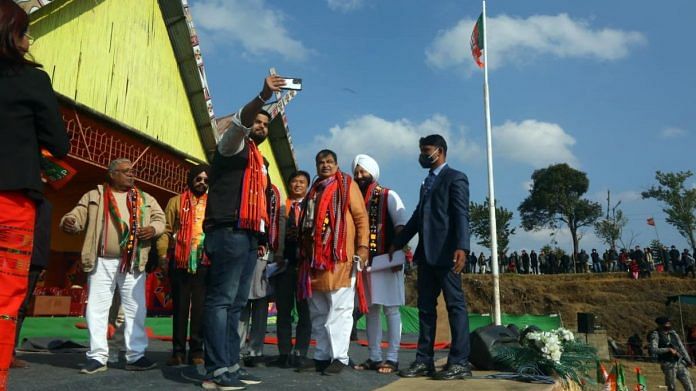 BJP supporters take a selfie with Union Minister Nitin Gadkari during a public meeting at Mission ground in Alung Tang, Manipur