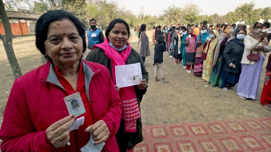 Women voters show their ID cards before casting their votes for the fourth phase of Uttar Pradesh Assembly elections in Lucknow, on 23 February 2022 | ANI photo