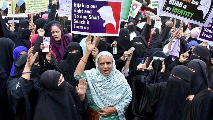 Women raise slogans and protest against the hijab ban imposed in the few colleges in Karnataka, in Mumbai on 13 February 2022 | Representational image | Photo: ANI