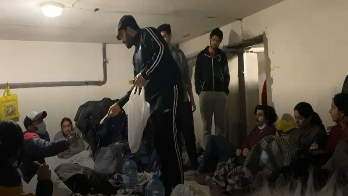 A young man passes out food and snacks to Indian students in an underground bunker in Kharkiv, Sunday | Ishita Choudhary | By special arrangement