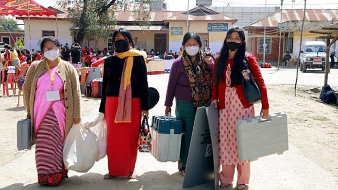 Polling officials carrying EVMs and other polling materials on the eve of the first phase of Manipur Assembly elections on 27 February 2022 | ANI Photo