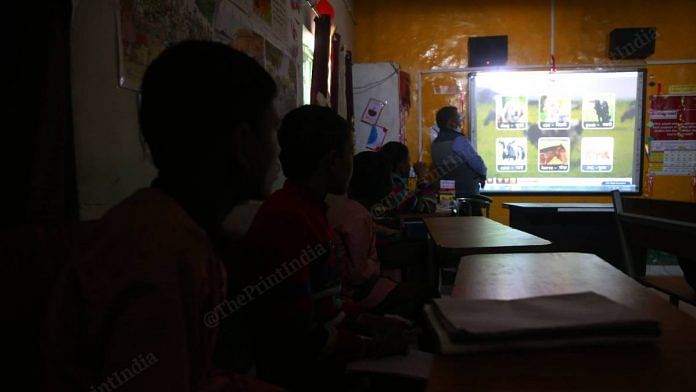 Students at the upper primary model school in Pandey Purwa village being taught with the help of audio-visual medium | Photo: Manisha Mondal | ThePrint