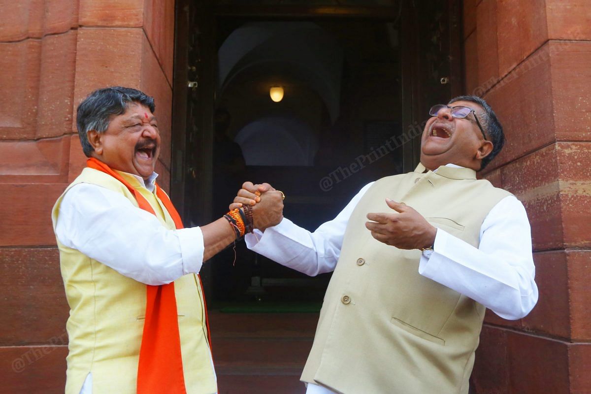 BJP leader Kailash Vijayvargiya and MP Ravi Shankar Prasad share a light moment | Photo: Praveen Jain | ThePrint