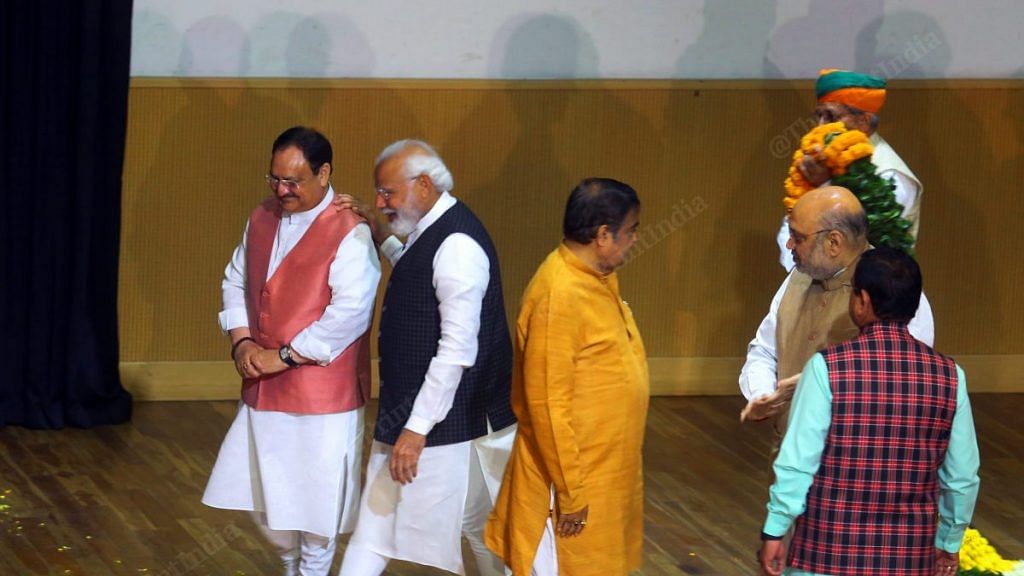 Prime Minister Narendra Modi and BJP chief J.P. Nadda leave the dais after being felicitated for the party's electoral victories at a parliamentary party meet on 15 March | Photo: Praveen Jain | ThePrint