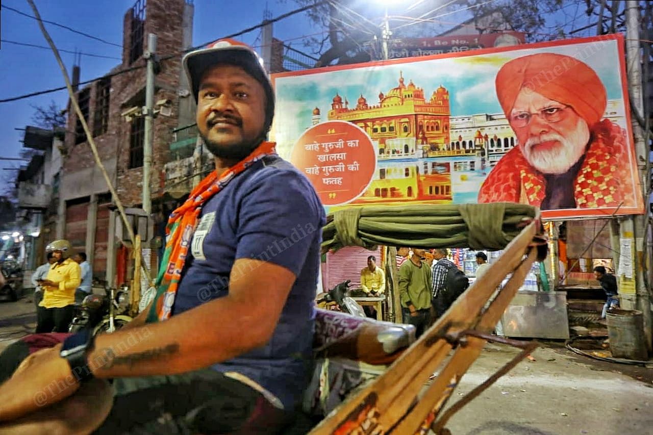 A hoarding of PM Modi wearing turban at Loha Mandi in Varanasi | Photo: Praveen Jain | ThePrint
