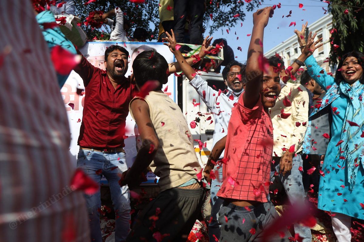 AAP workers and supporters celebrate the party's victory in Punjab polls at the AAP office in New Delhi | Photo: Manisha Mondal | ThePrint