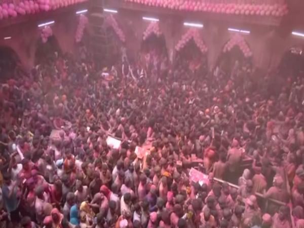 People throng at Vrindavan's Banke Bihari temple to celebrate Holi