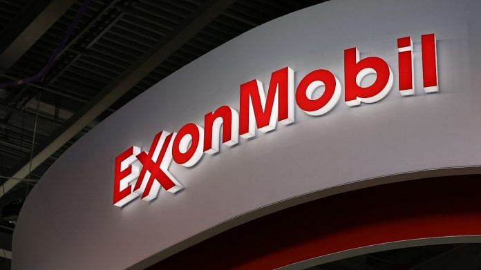 A logo sits illuminated outside the Exxon Mobil Corp. corporate pavilion during the 21st World Petroleum Congress in Moscow | File photo | Bloomberg