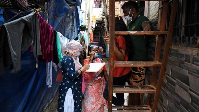 File photo of a healthcare volunteer conducting a door-to-door survey in Mumbai's Dharavi to find out if residents are having tuberculosis symptoms | ANI