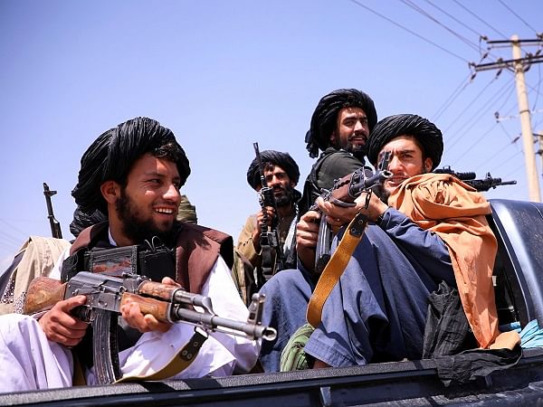 Taliban humiliates musicians by hanging instruments around their necks