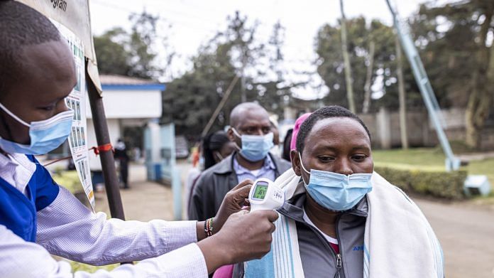 Residents have their temperature scanned during a Covid vaccination drive in Nairobi, Kenya | Photo: Patrick Meinhardt | Bloomberg File Photo