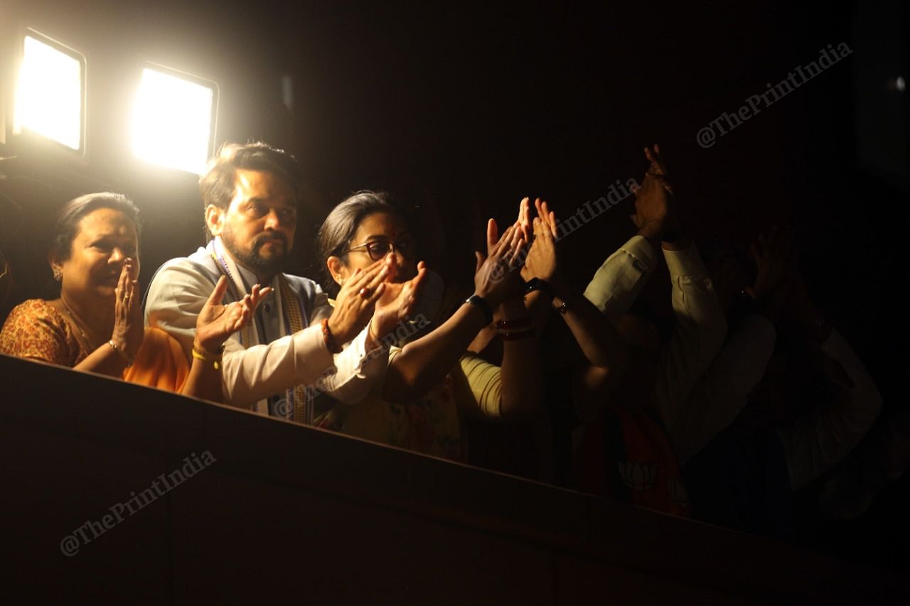 Union ministers Anurag Thakur and Smriti Irani cheer as Modi addresses party workers | Photo: Praveen Jain | ThePrint