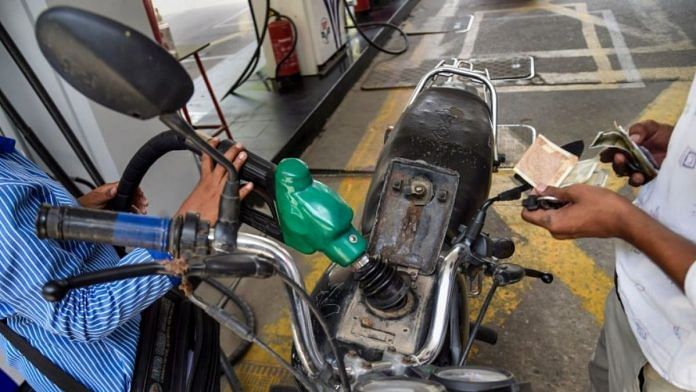 A pump attendant fills petrol in a bike at a fuel station in New Delhi | Representational image| PTI