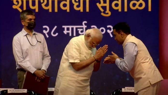 Prime Minister Narendra Modi and Goa Chief Minister Pramod Sawant (R) during the swearing-in ceremony at Dr Syama Prasad Mookerjee stadium near Panaji on 28 March 2022 | Photo: Twitter/@BJP4India