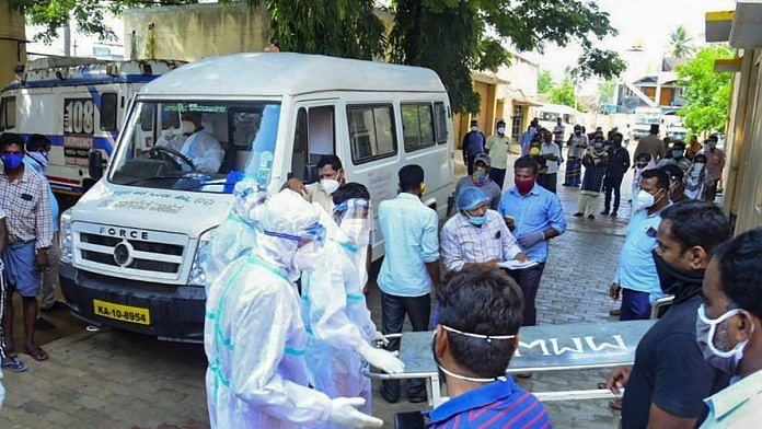 Medics and relatives after 24 Covid-19 patients died, allegedly due to shortage of oxygen cylinders, in Chamarajanagara District of Karnataka on 3 May 2021 | PTI