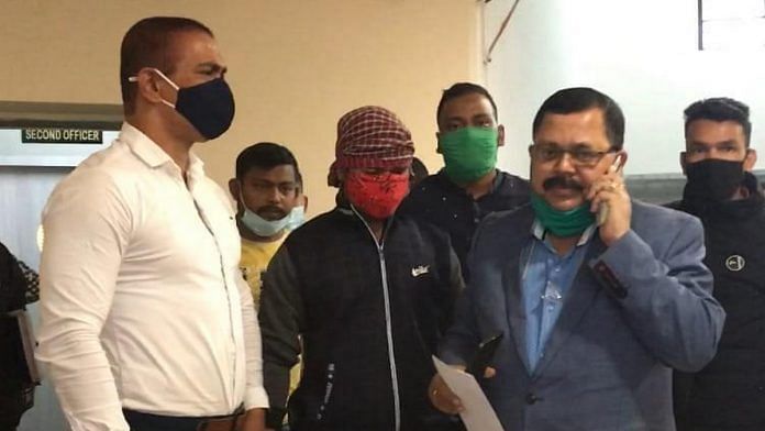 Arrested KLO operative Abinash Roy (centre) with Sudip Bhattacharya, DSP of the Siliguri Special Task Force | Photo: By special arrangement