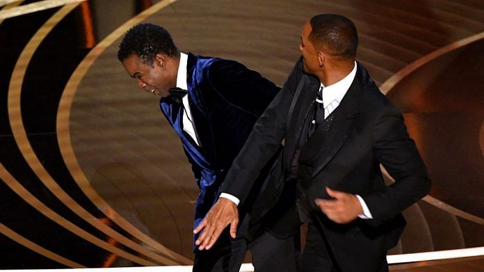 Will Smith slaps Chris Rock onstage during the 94th Oscars at the Dolby Theatre in Hollywood, California, on 27 March 2022 | Photographer: Robyn Beck/AFP/Getty Images via Bloomberg