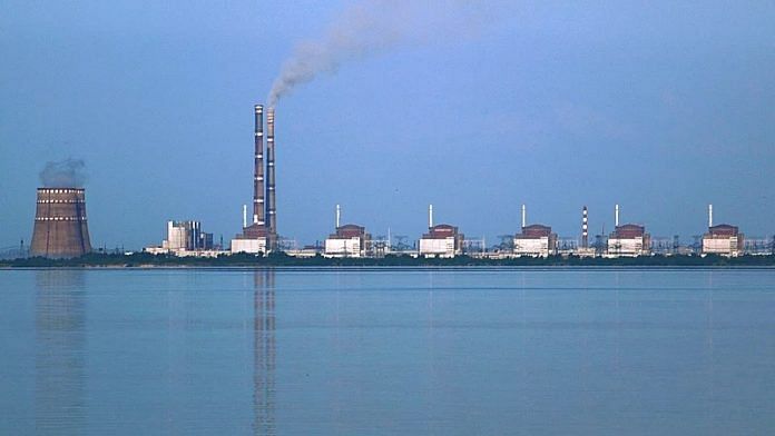 Zaporizhzhia thermal power station (on the left) next to six units of the nuclear plant viewed from Nikopol shore