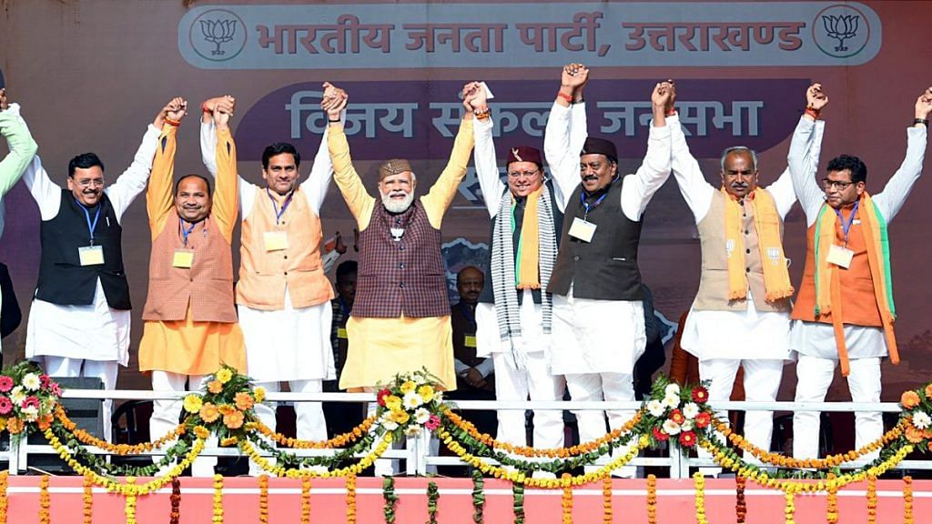 File photo of Prime Minister Narendra Modi with Uttarakhand Chief Minister Pushkar Singh Dhami and BJP leaders during the Vijay Sankalp Sabha ahead of assembly elections, at Rudrapur | ANI