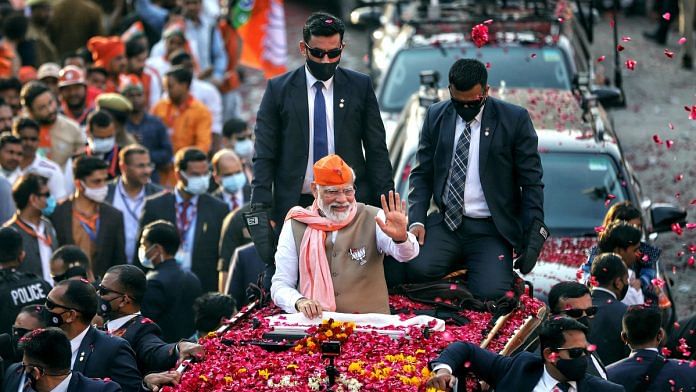 Prime Minister Narendra Modi during a roadshow in support of the party candidate for the last phase of the Uttar Pradesh assembly elections, in Varanasi on 4 March. | Photo: ANI