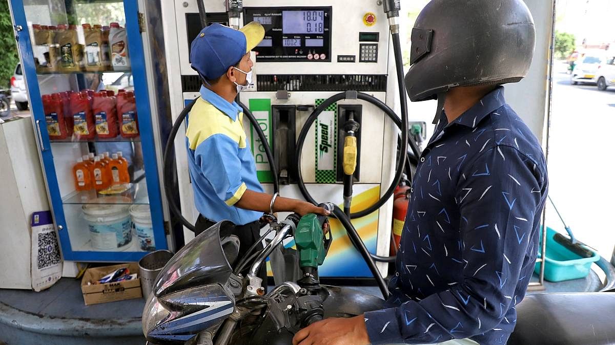 A petrol pump staffer refills fuel in a two-wheeler in New Delhi, on 29 March 2022 | ANI photo