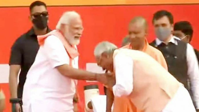 Bihar Chief Minister Nitish Kumar greets Prime Minister Narendra Modi at UP CM Yogi Adityanath's swearing in ceremony in Lucknow Friday | Twitter/@RJDforIndia
