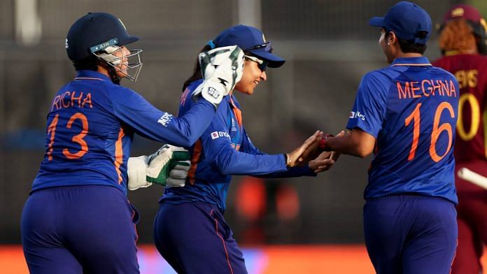 India's Sneh Rana, Meghna Singh and Richa Ghosh celebrate after the dismissal of West Indies opener Deandra Dottin on 12 March at Seddon park in Hamilton, New Zealand | Twitter | @BCCIWomen