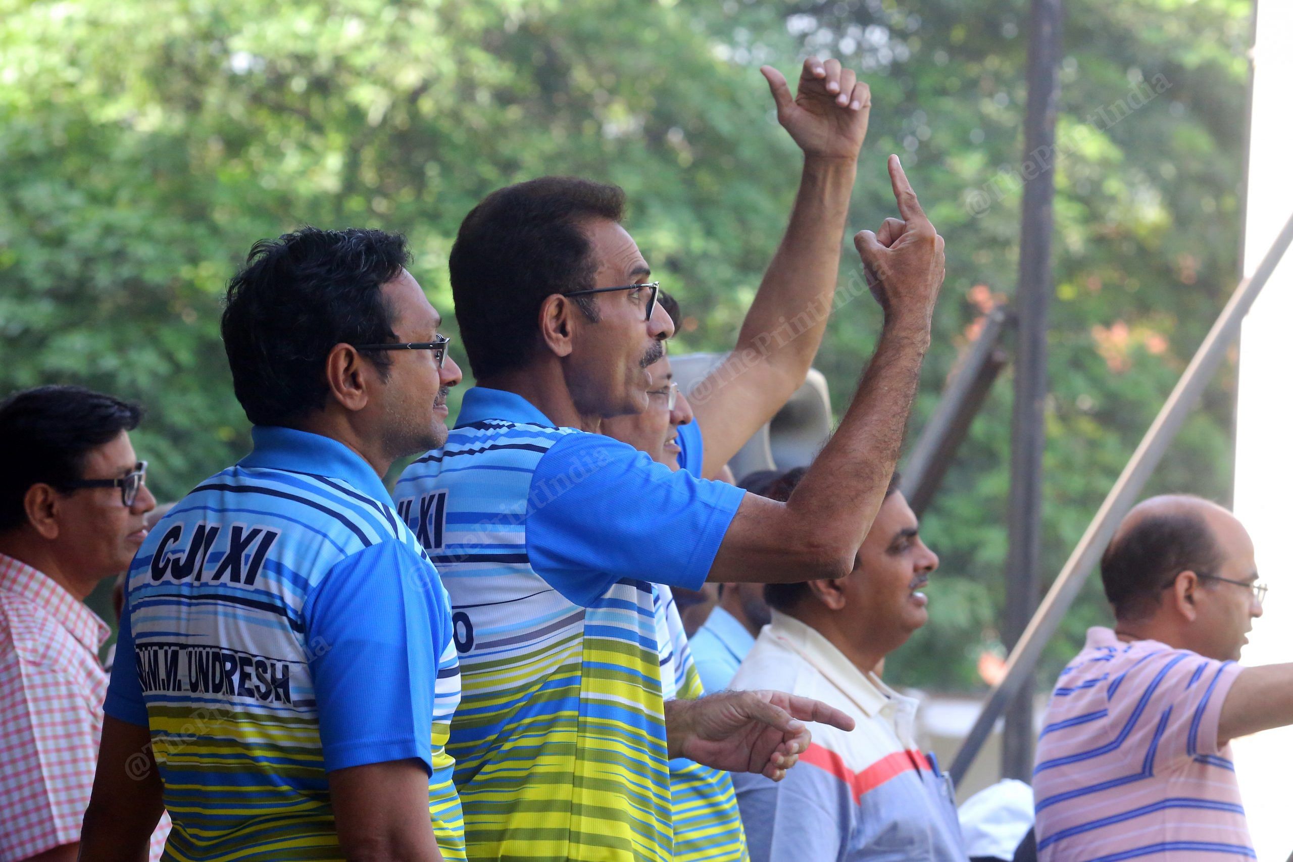 Justice L. Nageswara Rao and Justice M. M. Sundresh cheer for their team | Photo: Praveen Jain | ThePrint