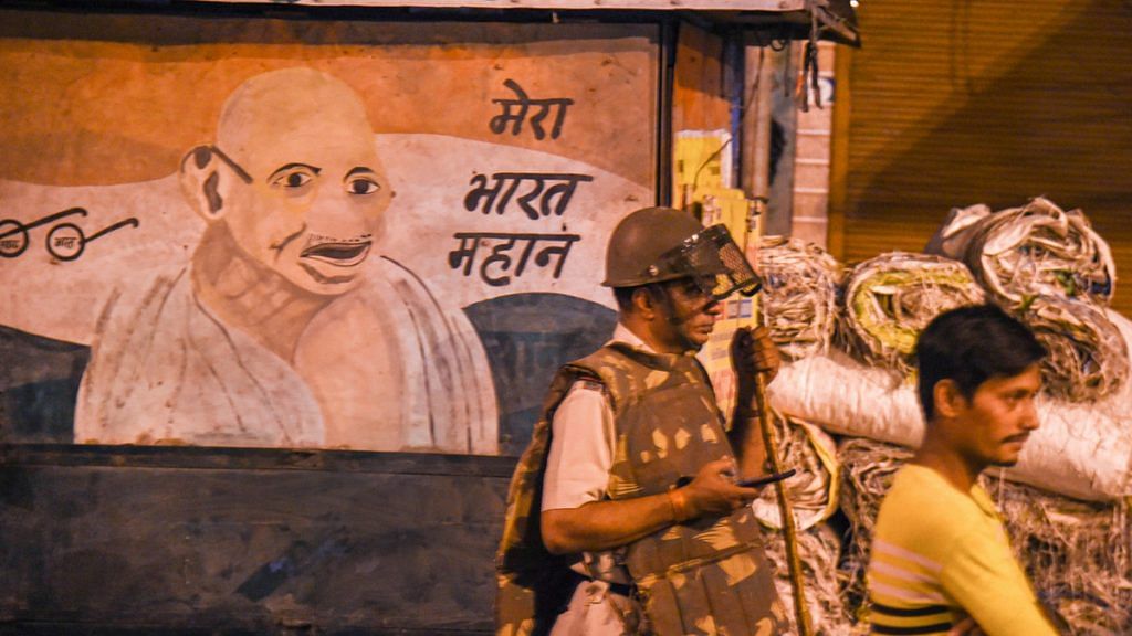 Police deployed to control the situation after violent clashes broke out during a Hanuman Jayanti procession at Jahangirpuri, New Delhi, 16 April 2022 |PTI