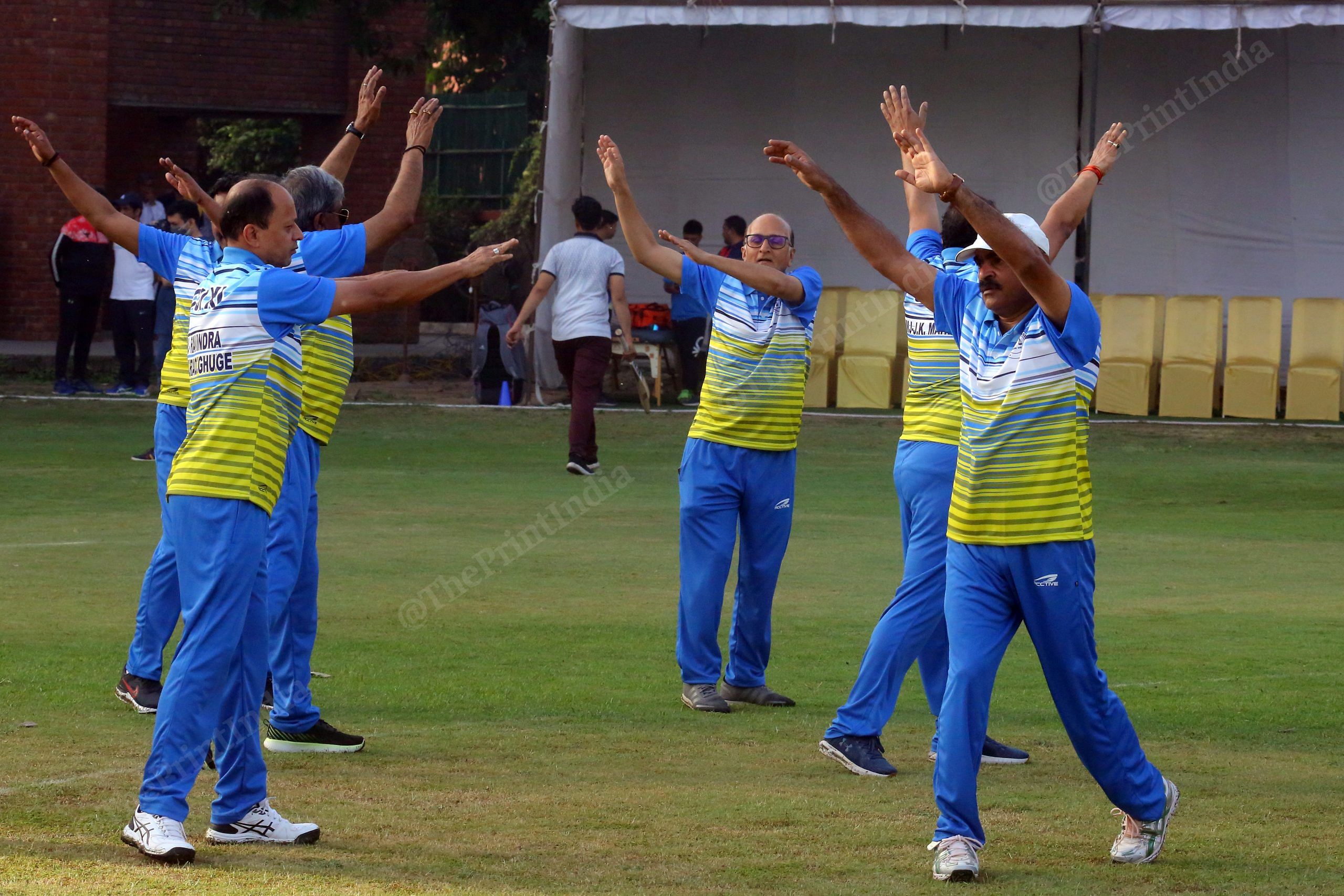 CJI -Xl player Justice Shripathi Ravindra Bhat (centre) warms up before the match, with others of his team | Photo: Praveen Jain | ThePrint