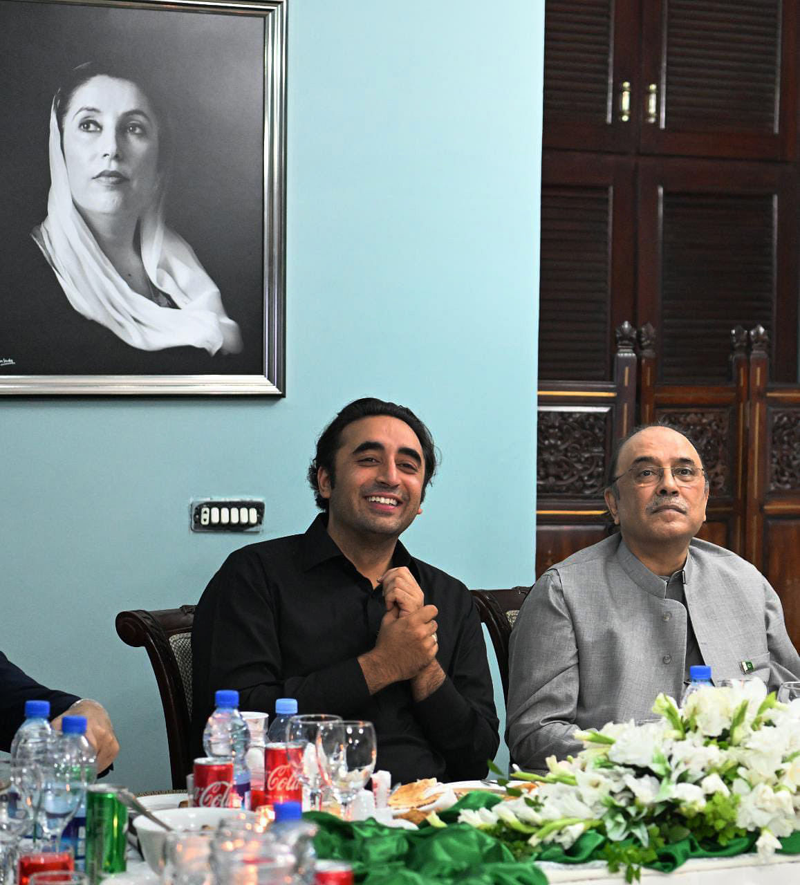 In this 5 April photo shared by Bakhtawar on Twitter, a portrait of the late Benazir Bhutto hangs in the room as Bilawal shares a light moment with his father Asif Ali Zardari | @BakhtawarBZ