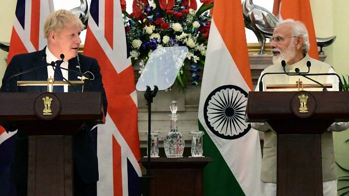 Prime Minister Narendra Modi and UK PM Boris Johnson deliver a joint press statement, at Hyderabad House in New Delhi Friday | ANI/Amlan Paliwal