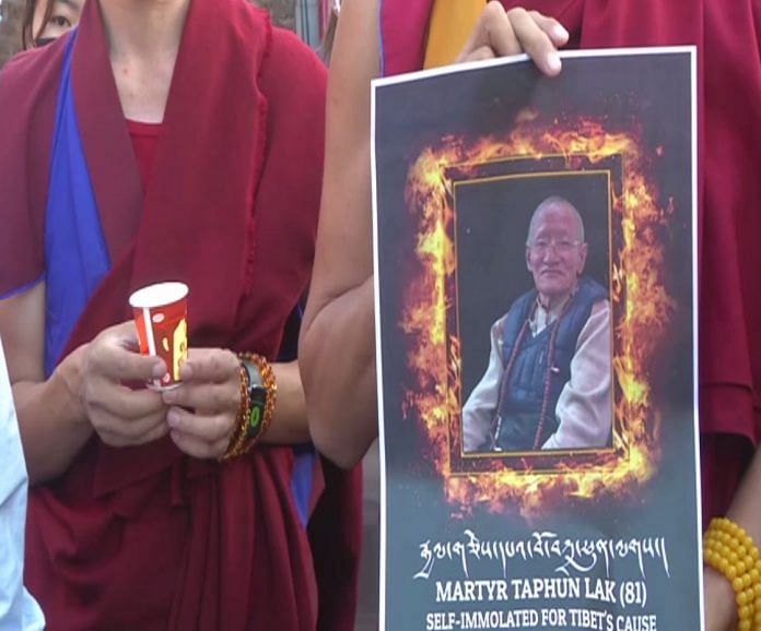 Tibetans hold candlelight vigil over self-immolation of 81-year-old man