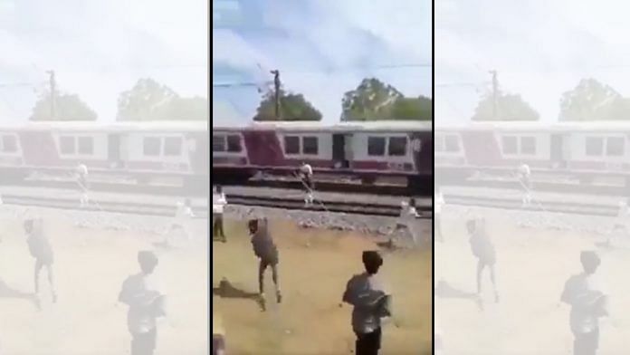 Screengrab of students throwing stones at rival college students on a train in Chennai