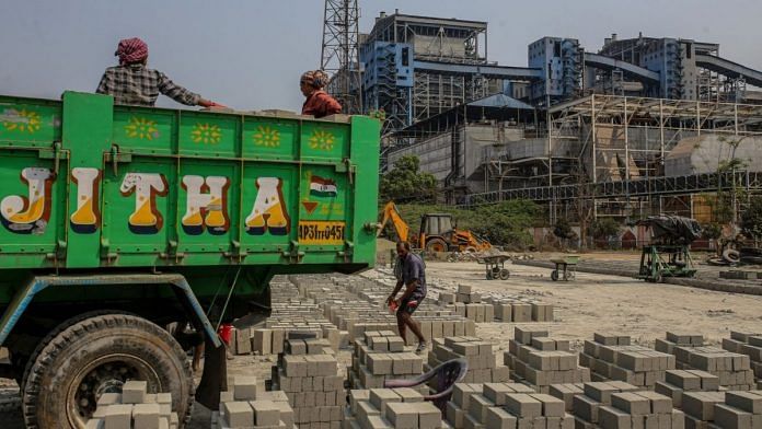 Workers at a concrete block manufacturing factory in the outskirts of Visakhapatnam | Representational image | Bloomberg