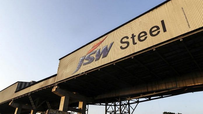 Signage for JSW Steel Ltd. is seen on the exterior of the company's manufacturing facility in Dolvi, Maharashtra | Bloomberg
