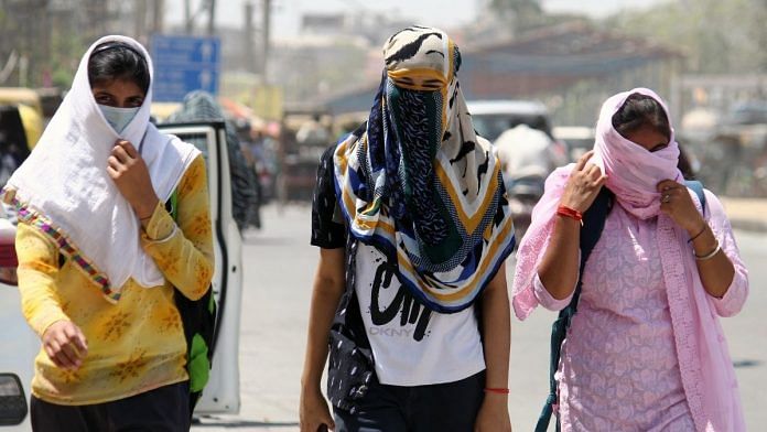 Women cover their faces with scarves to protect themselves from the scorching heat in Gurugram, on 5 April 2022 | ANI photo