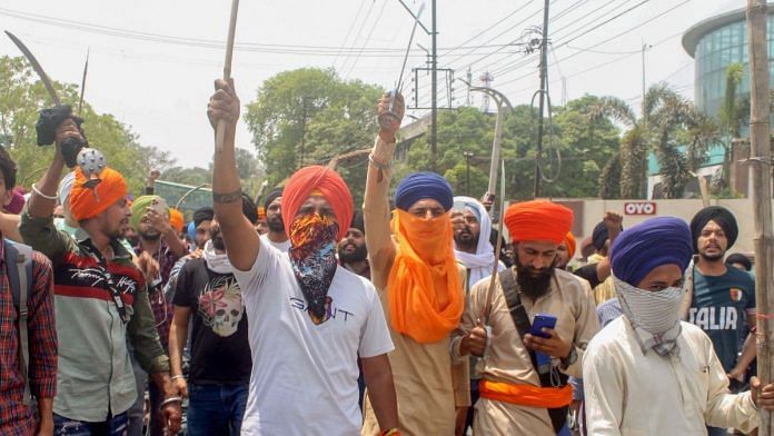 People gather after a clash broke out between followers of Shiv Sena and pro-Khalistani Sikh organisations near Kali Mata Mandir in Patiala, on 29 April 2022 | PTI