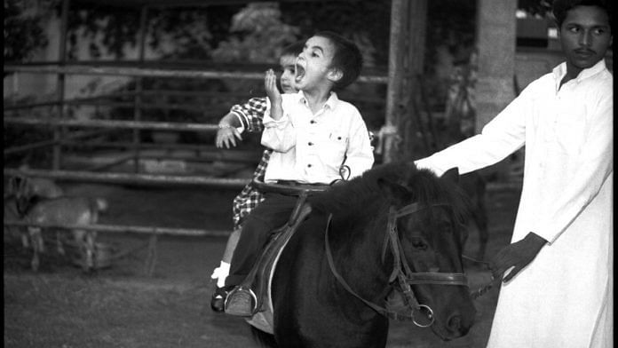 A four-year-old Bilawal Bhutto Zardari enjoys a horse ride with younger sister Bakhtawar, 2, in the garden of the Bhutto residence at Karachi, in September 1992 | Praveen Jain | ThePrint