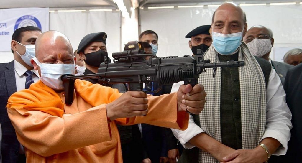 CM Yogi Adityanath holding rifle at DRDO exhibition | BJPUttarPradesh/Twitter