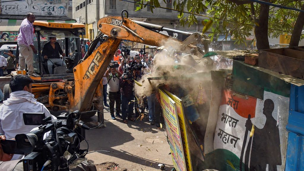 Bulldozers removing illegal structures during an anti-encroachment drive in Jahangirpuri area, in New Delhi, on 20 April 2022 | PTI Photo